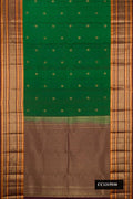 Bottle Green Dual Tone Kanchipuram Silk Saree with Zari Butta on the body and Fancy Border.  displayed on a mannequin