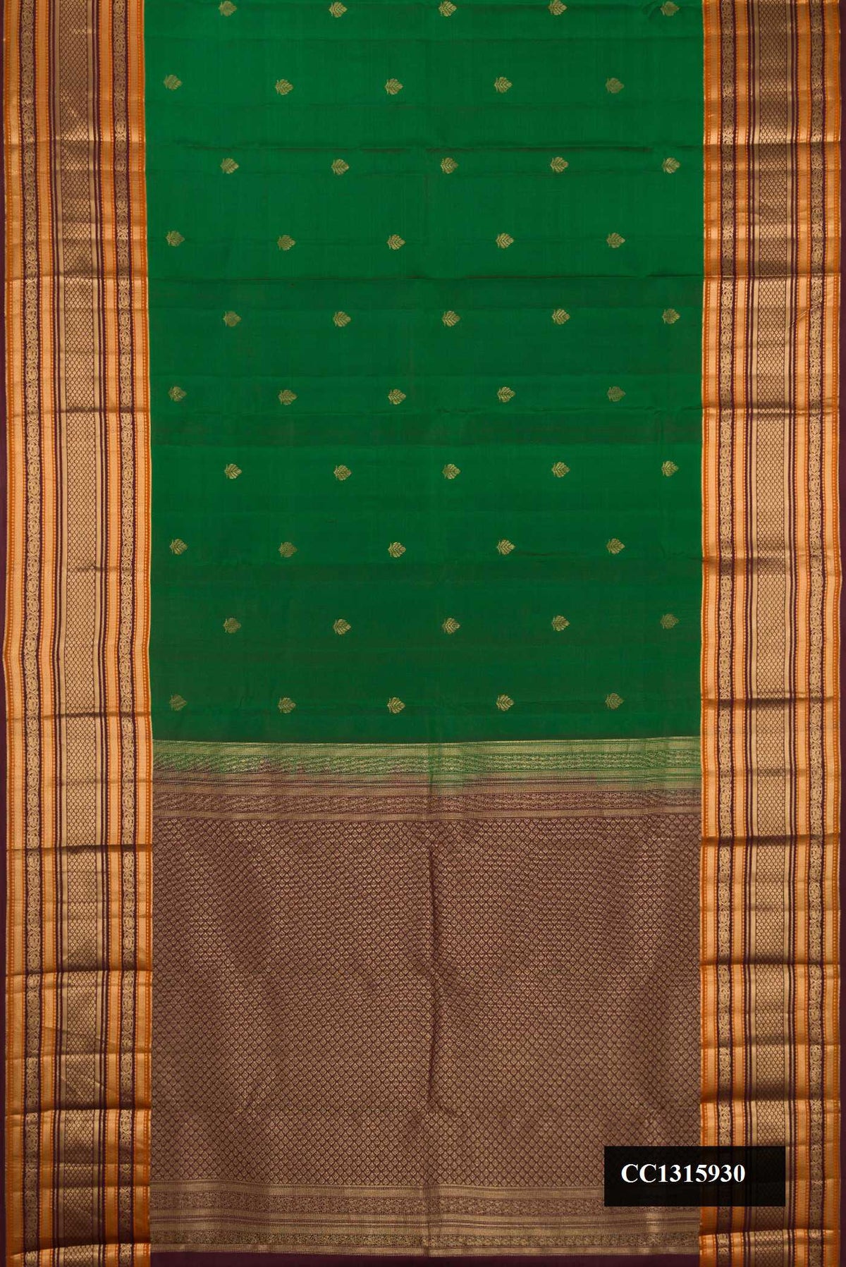 Bottle Green Dual Tone Kanchipuram Silk Saree with Zari Butta on the body and Fancy Border.  displayed on a mannequin