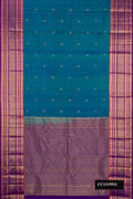 Peacock Blue Dual Tone Kanchipuram Silk Saree with Zari Butta on the body and Fancy Border.  displayed on a mannequin