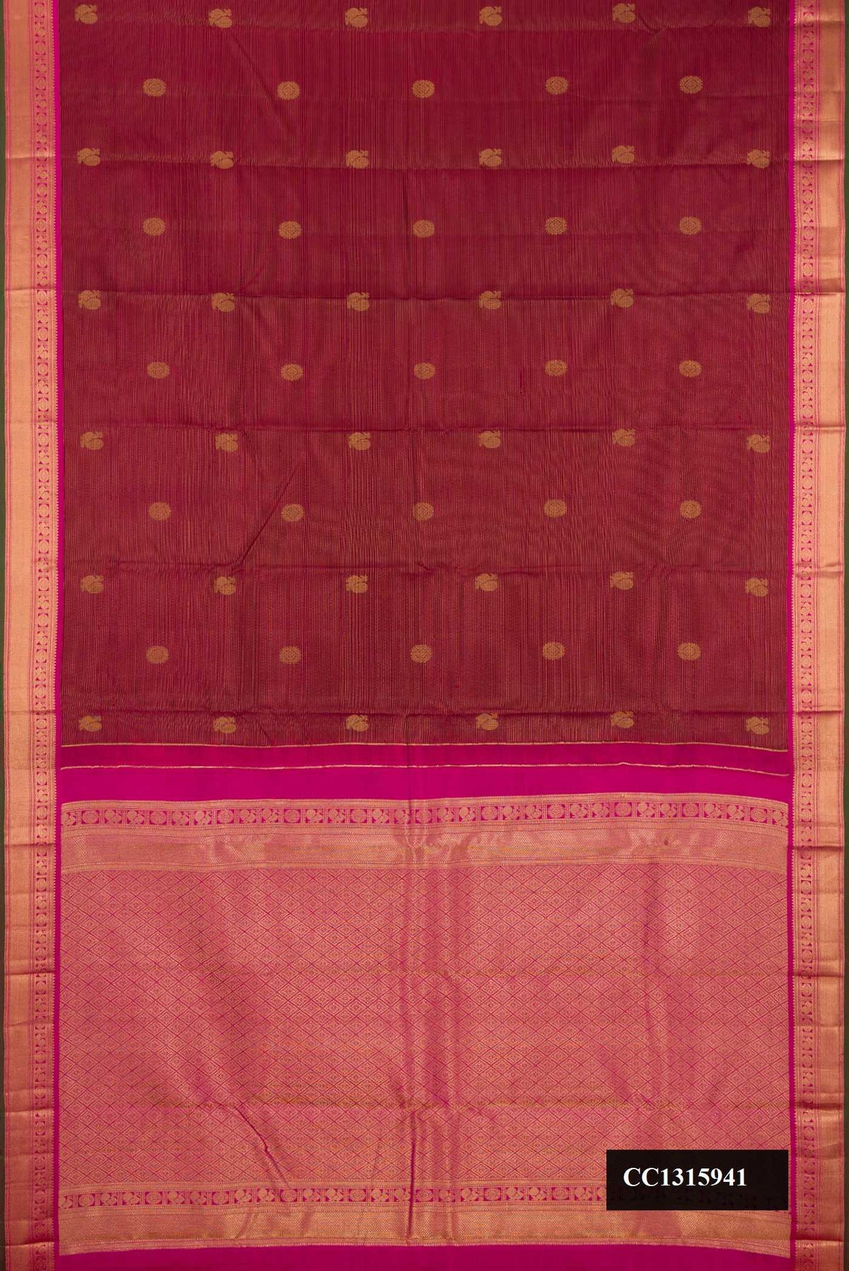 Maroon Dual Tone Kanchipuram Silk Saree with Stripes on the body and Zari Border.  displayed on a mannequin