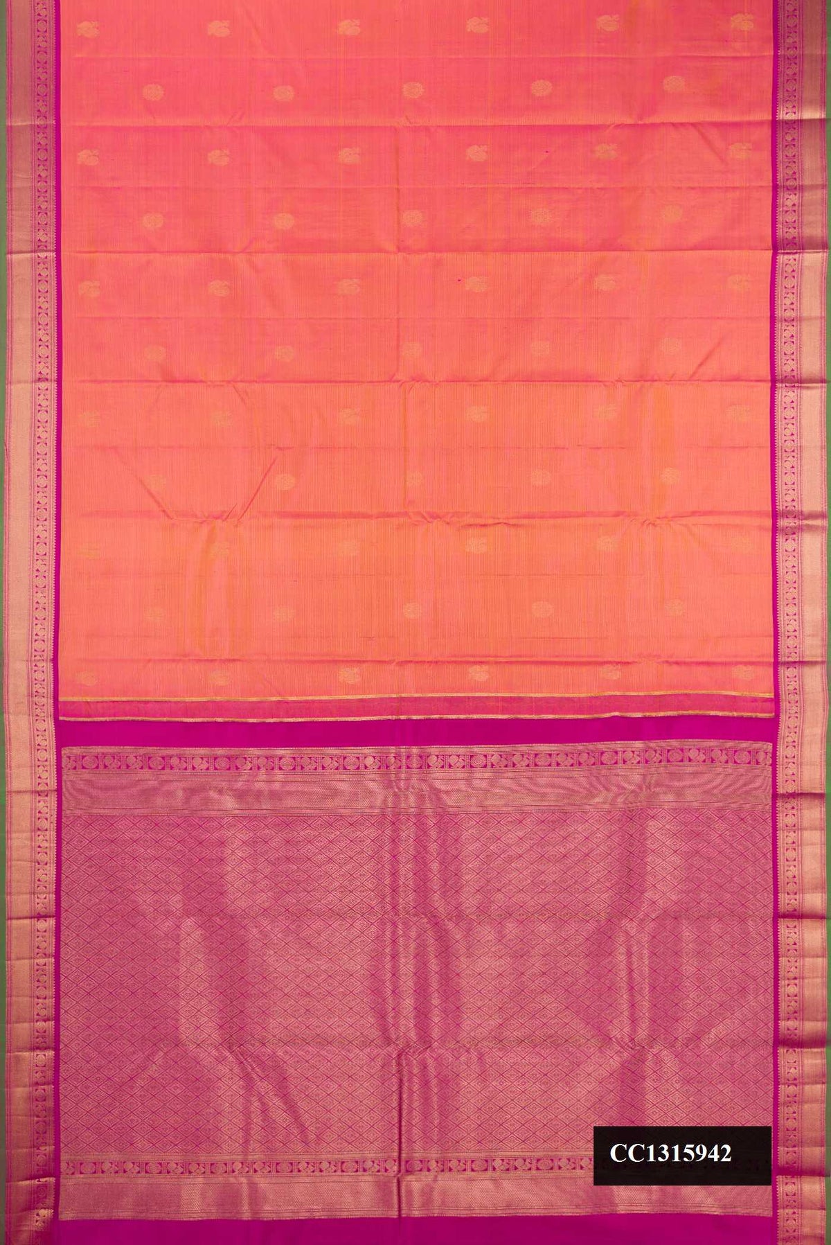 Coral Dual Tone Kanchipuram Silk Saree with Zari Butta on the body and Zari Border.  displayed on a mannequin