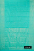 Sea Green Dual Tone Kanchipuram Silk Saree with Checked design on the body and Zari Border.  displayed on a mannequin