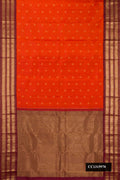 Brick Orange Dual Tone Kanchipuram Silk Saree with Zari Butta on the body and Zari Border.  displayed on a mannequin