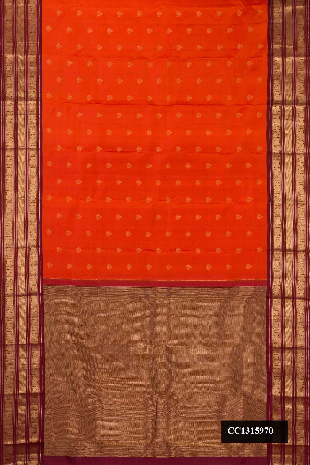 Brick Orange Dual Tone Kanchipuram Silk Saree with Zari Butta on the body and Zari Border.  displayed on a mannequin