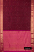 Maroon Dual Tone Kanchipuram Silk Saree with Zari Butta on the body and Zari Border.  displayed on a mannequin