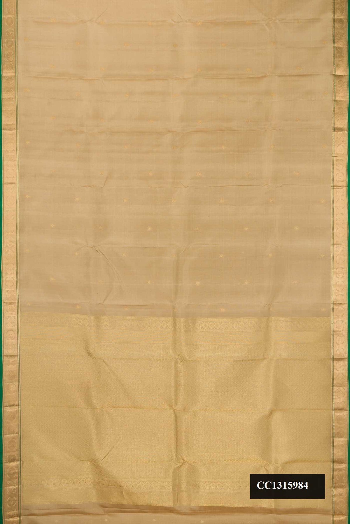 Beige Dual Tone Kanchipuram Silk Saree with Zari Butta on the body and Zari Border.  displayed on a mannequin