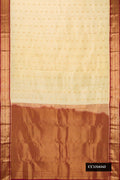 Sandal Dual Tone Kanchipuram Silk Saree with Zari Butta on the body and Zari Border.  displayed on a mannequin