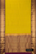 Mehandi Green Dual Tone Kanchipuram Silk Saree with Zari Butta on the body and Zari Border.  displayed on a mannequin