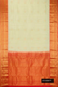 Pista Green Dual Tone Kanchipuram Silk Saree with Zari Butta on the body and Zari Border.  displayed on a mannequin