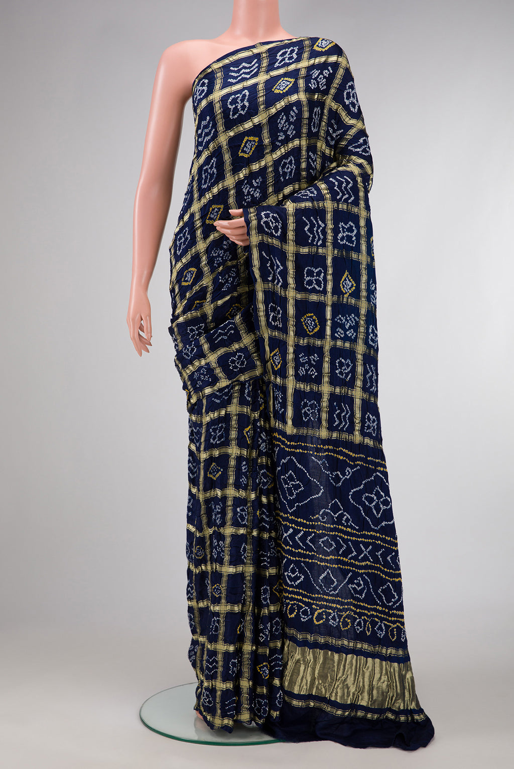 Navy Blue Dual Tone Bandhani Silk Saree with Bandhani Print on the body and Without Border.  displayed on a mannequin