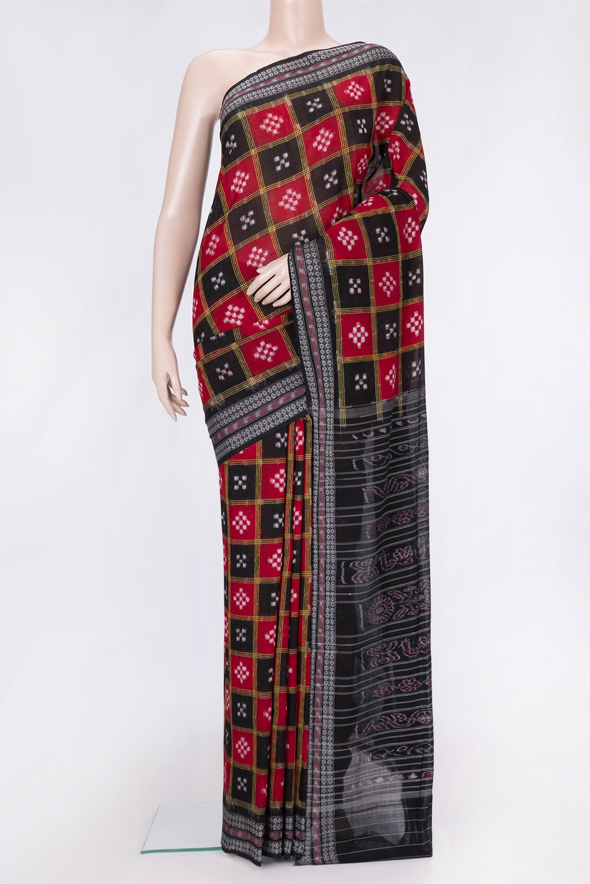 Black and Maroon Color Double Ikat Saree with Ikat Print on the body and Thread Border.  displayed on a mannequin