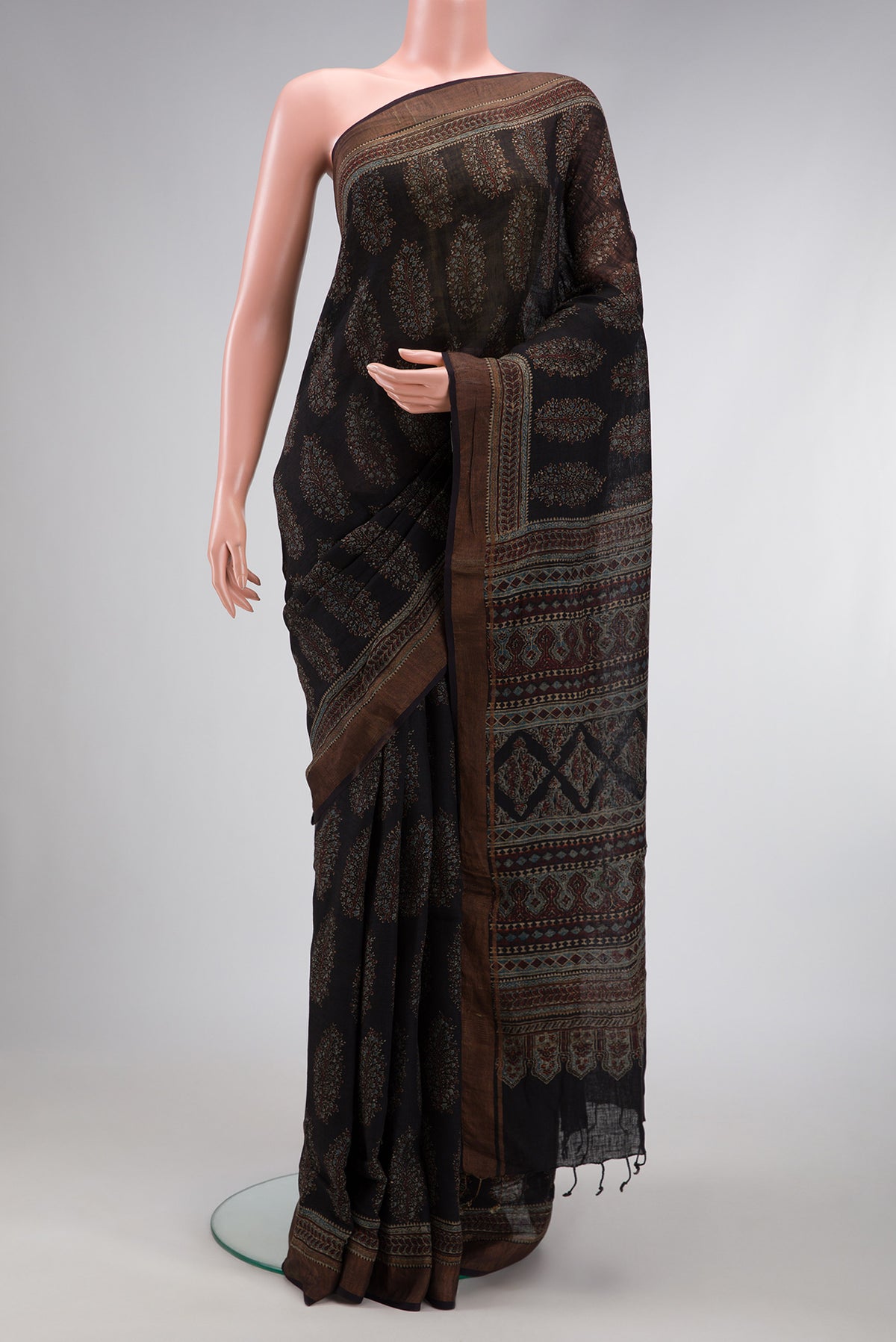 Black Dual Tone Maheshwari Silk Saree with Zari Butta on the body and Zari Border.  displayed on a mannequin