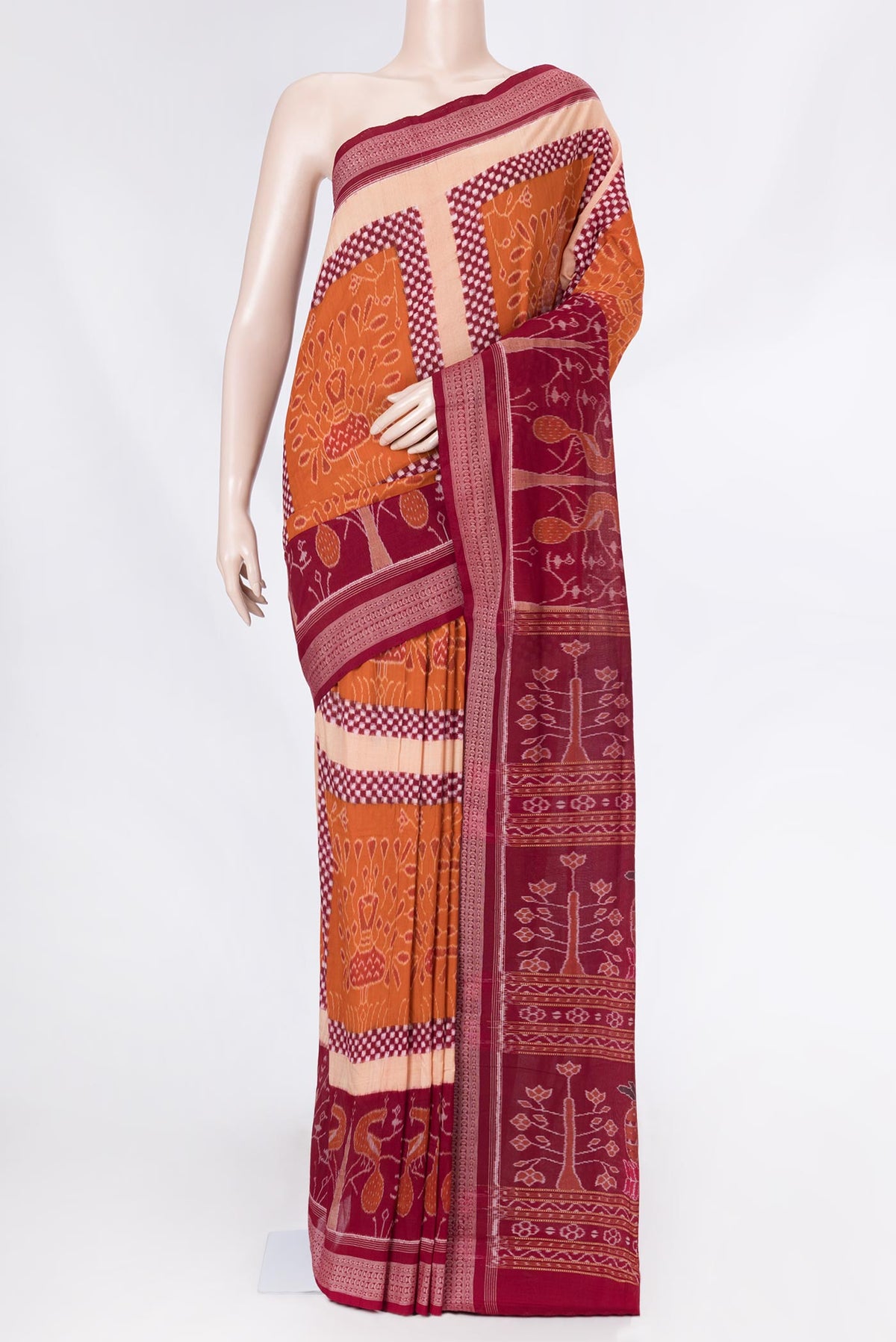 Orange Dual Tone Double Ikat Saree with Ikat Print on the body and Ikat Border displayed on a mannequin