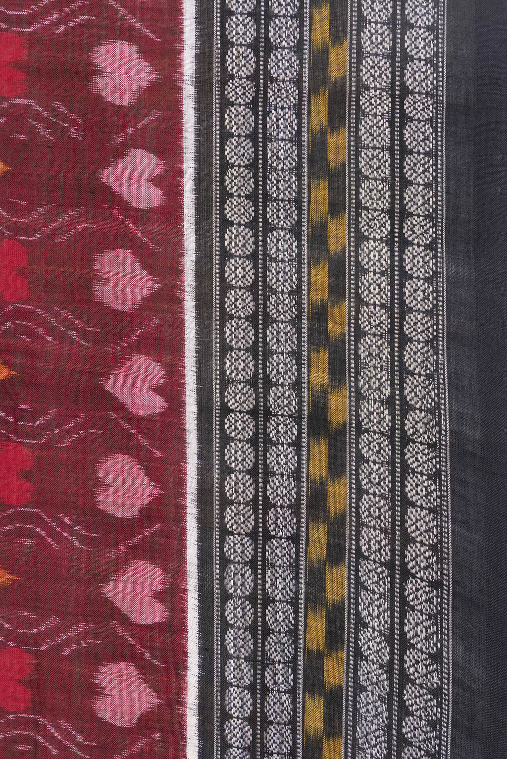 Border image of Maroon Dual Tone Double Ikat Saree with Ikat Print on the body and Thread Border. 