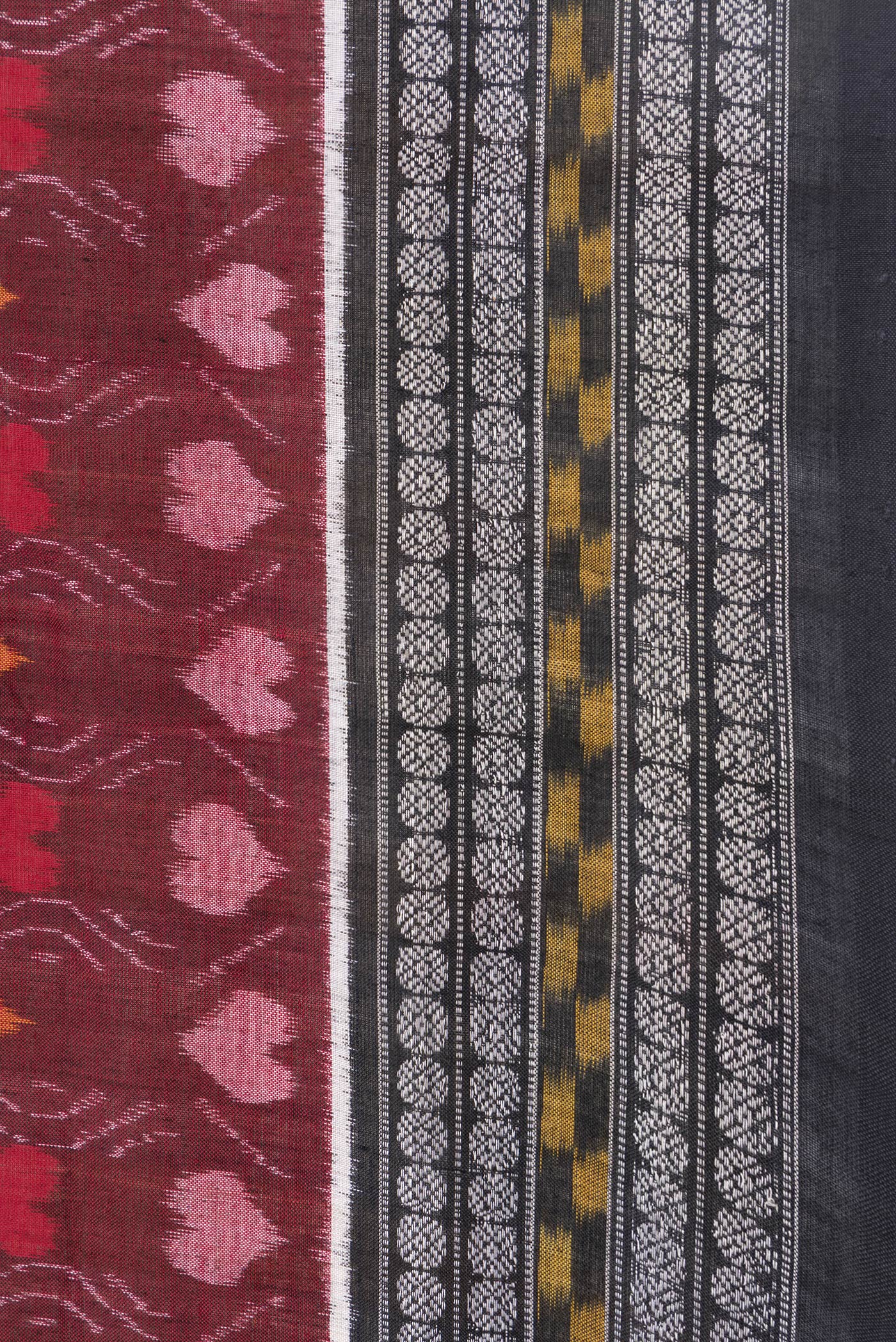 Border image of Maroon Dual Tone Double Ikat Saree with Ikat Print on the body and Thread Border. 