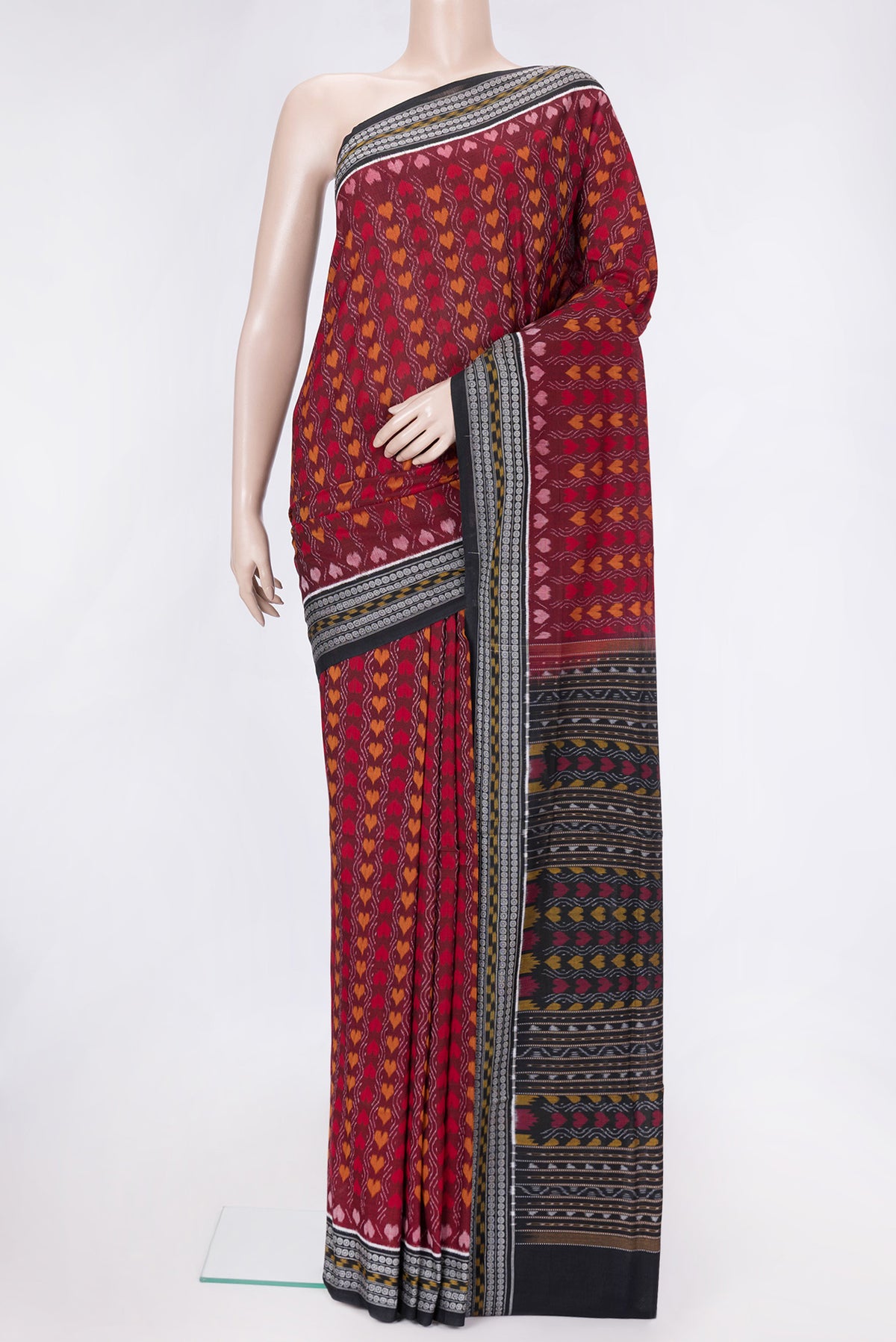 Maroon Dual Tone Double Ikat Saree with Ikat Print on the body and Thread Border.  displayed on a mannequin