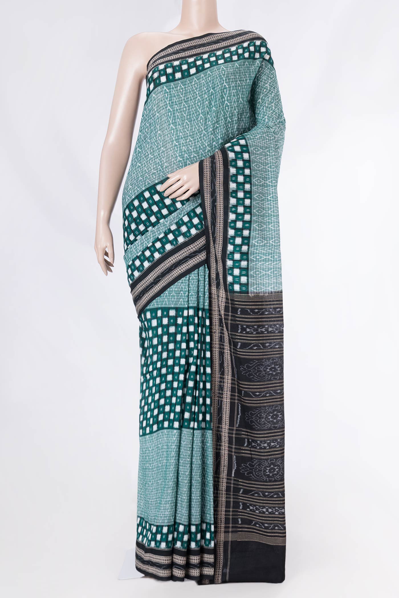 Green Dual Tone Double Ikat Saree with Ikat Print on the body and Ikat Border displayed on a mannequin