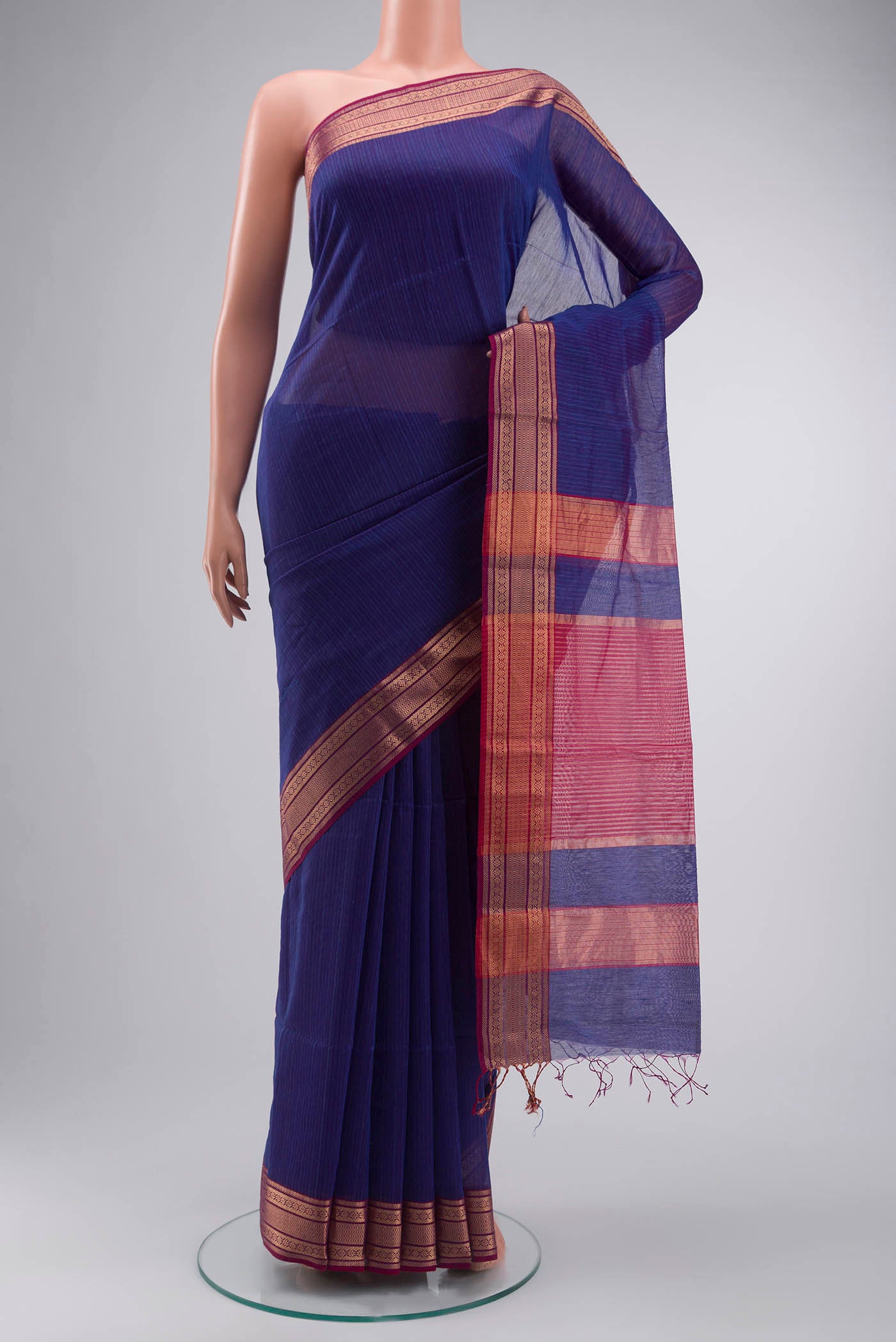 Blue Maheshwari Silk Cotton Saree with Stripes on the body and Zari Border displayed on a mannequin