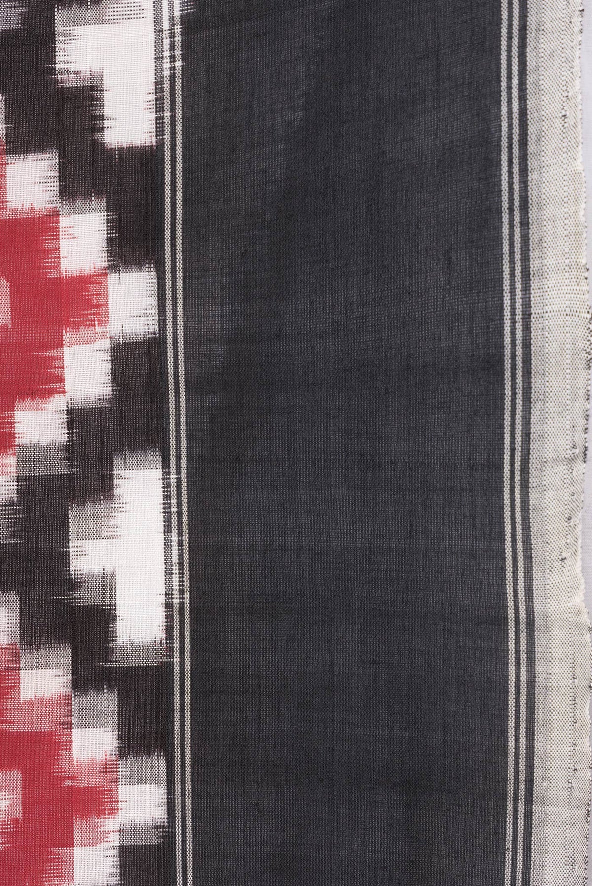Border image of Black and Maroon Color Double Ikat Saree with Ikat Print on the body and Plain Border. 