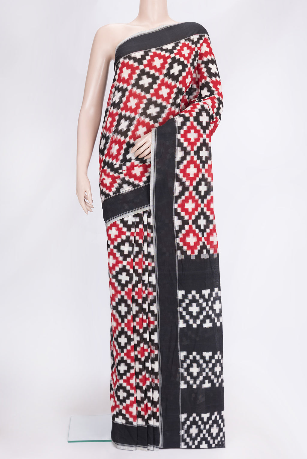 Black and Maroon Color Double Ikat Saree with Ikat Print on the body and Plain Border.  displayed on a mannequin