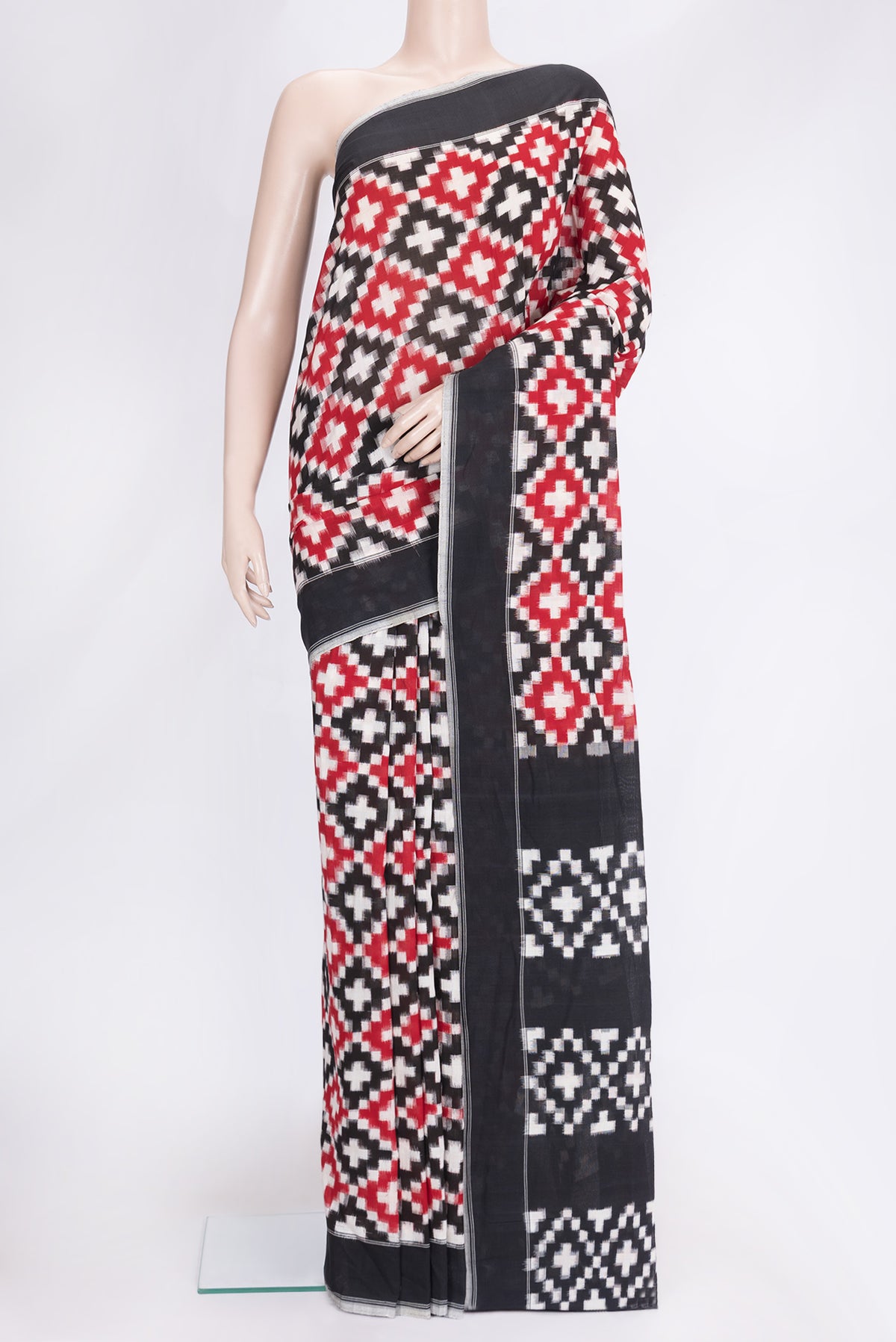 Black and Maroon Color Double Ikat Saree with Ikat Print on the body and Plain Border.  displayed on a mannequin