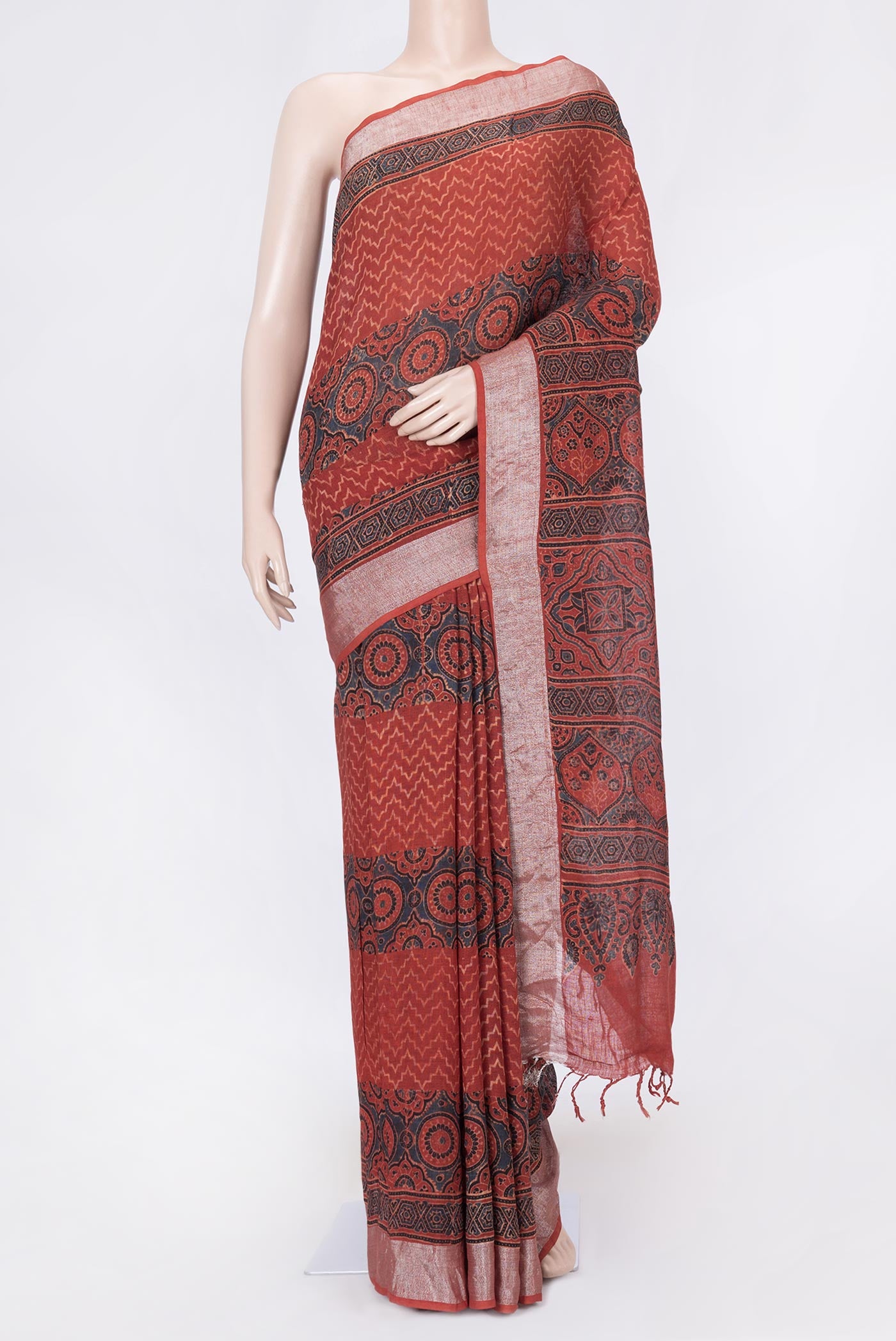 Red Dual Tone Linen Saree with Printed design on the body and Zari Border displayed on a mannequin