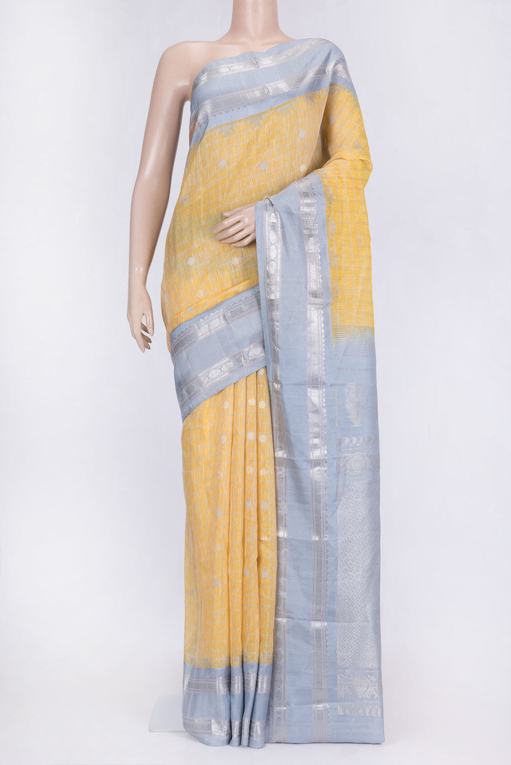 Lemon Yellow Dual Tone Linen Saree with Checked design on the body and Zari Border.  displayed on a mannequin