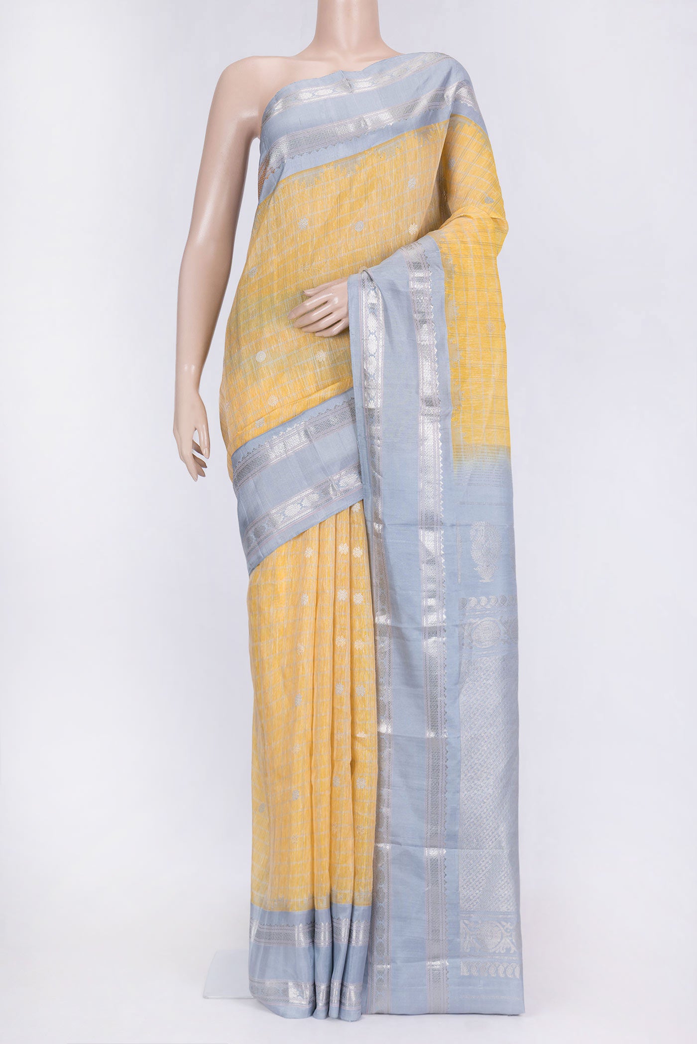 Lemon Yellow Dual Tone Linen Saree with Checked design on the body and Zari Border.  displayed on a mannequin