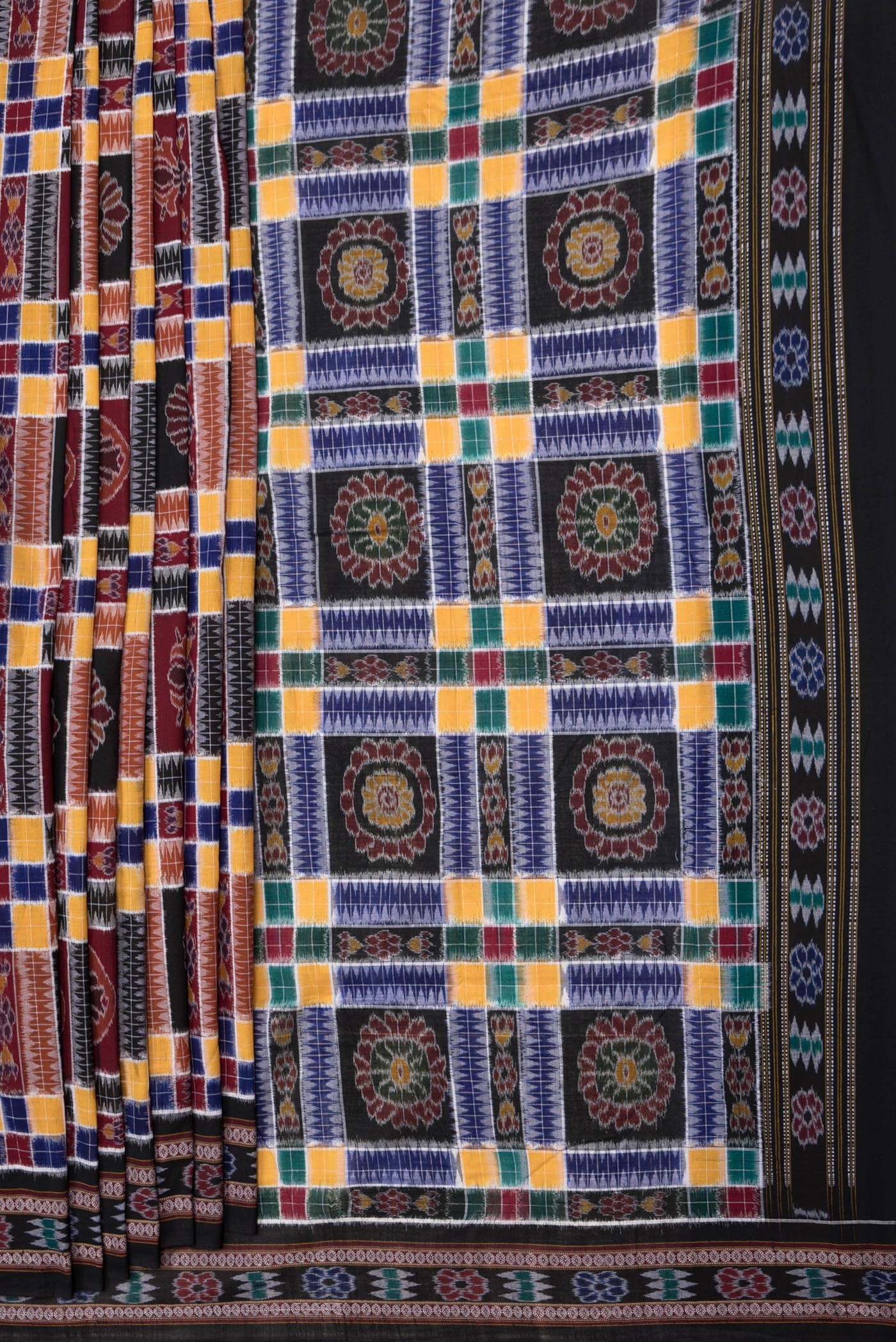 Pleats and pallu of Black and Maroon Color Double Ikat Saree with Ikat Print on the body and Thread Border. 