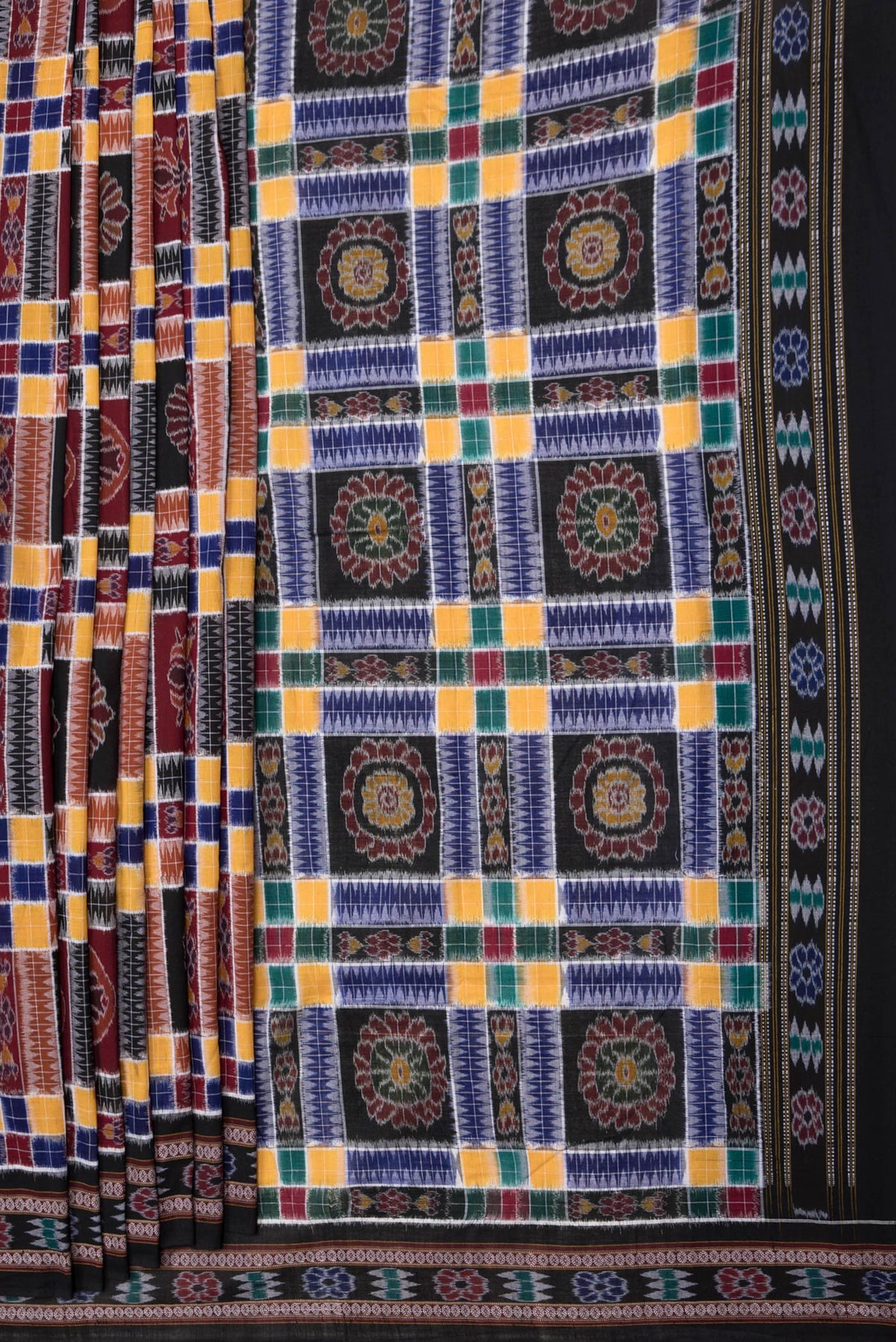 Pleats and pallu of Black and Maroon Color Double Ikat Saree with Ikat Print on the body and Thread Border. 