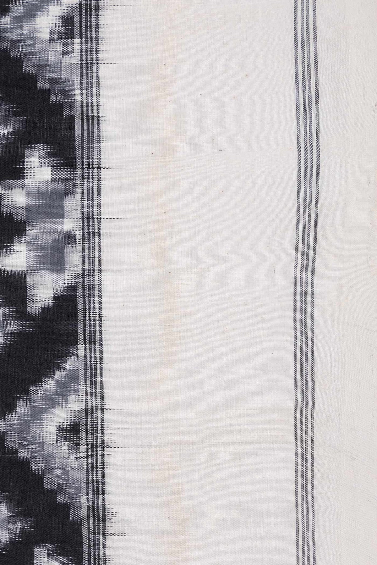 Border image of Black Dual Tone Double Ikat Saree with Ikat Print on the body and Plain Border