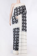 Black Dual Tone Double Ikat Saree with Ikat Print on the body and Plain Border displayed on a mannequin