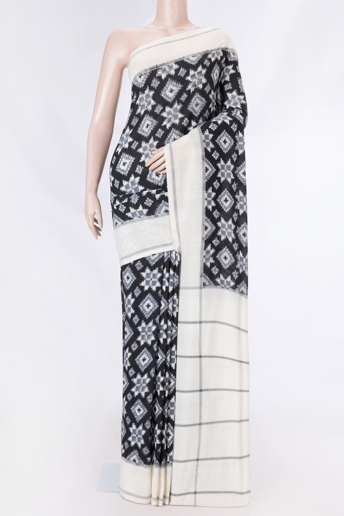 Black Dual Tone Double Ikat Saree with Ikat Print on the body and Plain Border displayed on a mannequin