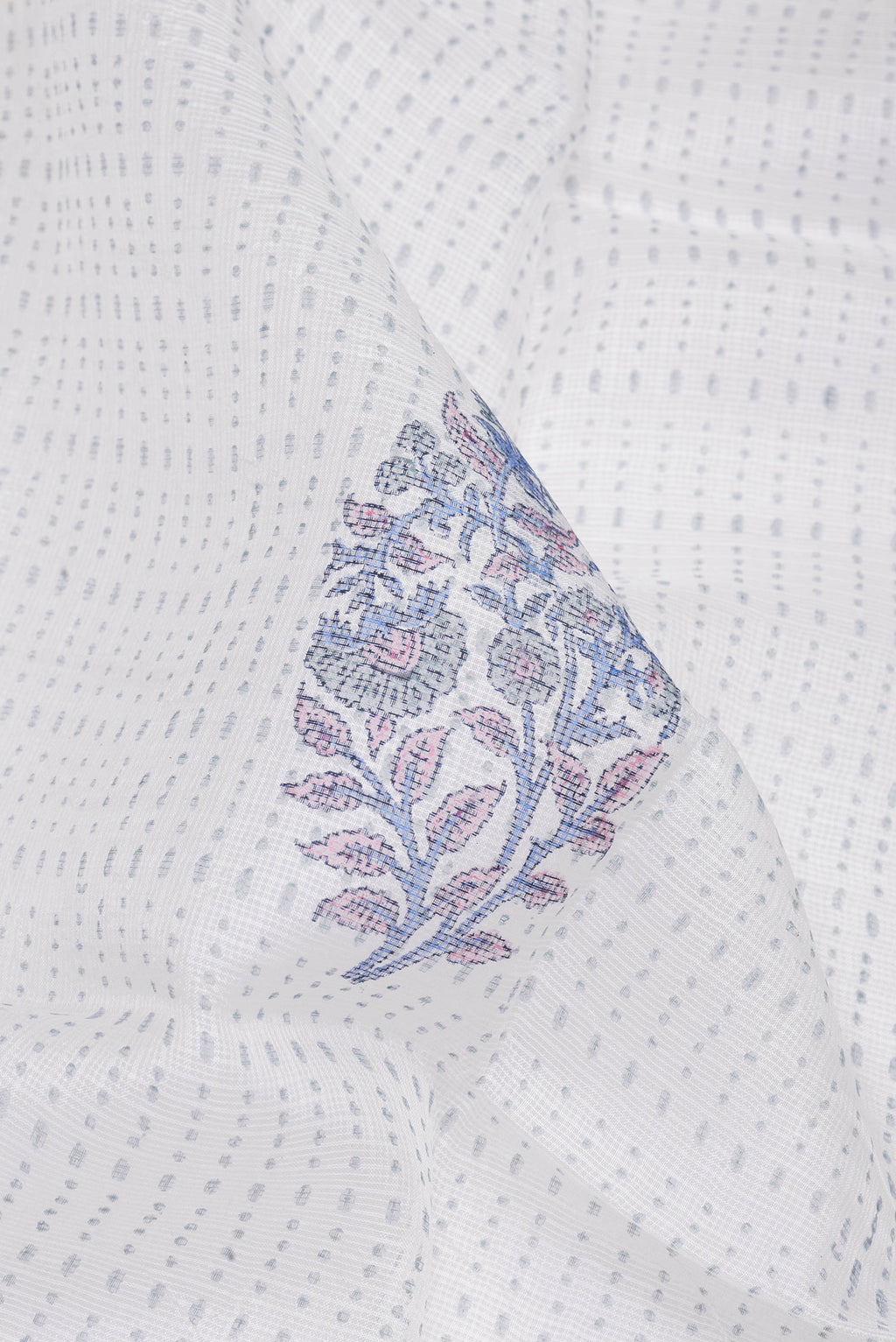 Close up of White Kota Silk Saree with Printed design on the body and Printed Border.  displaying folds