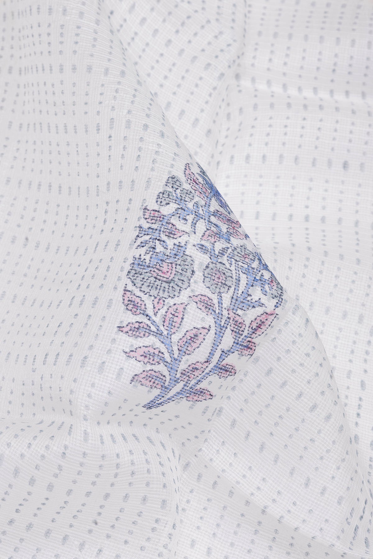 Close up of White Kota Silk Saree with Printed design on the body and Printed Border.  displaying folds