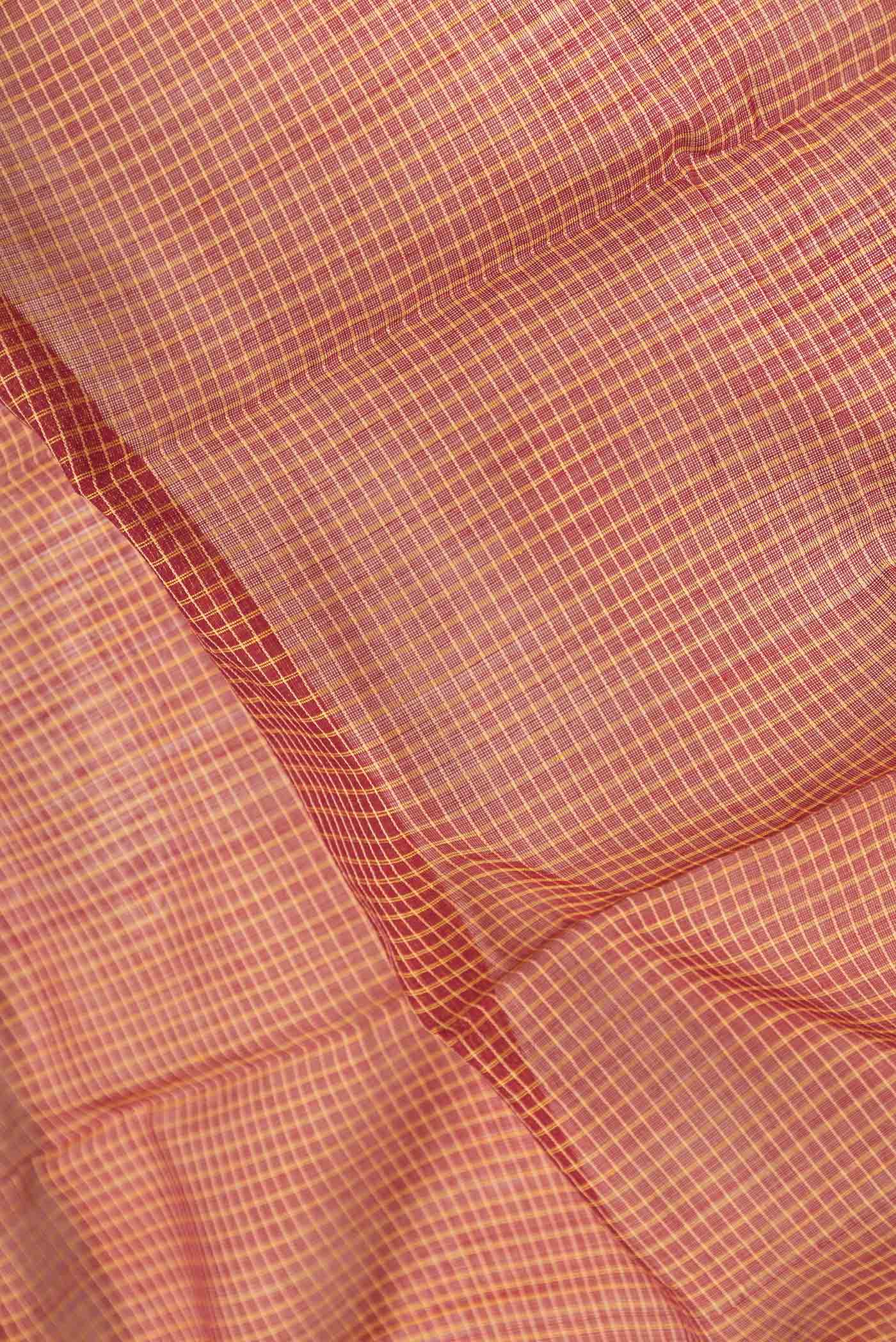 Close up of Maroon Dual Tone Gadwal Silk Saree with Checked design on the body and Zari Border.  displaying folds
