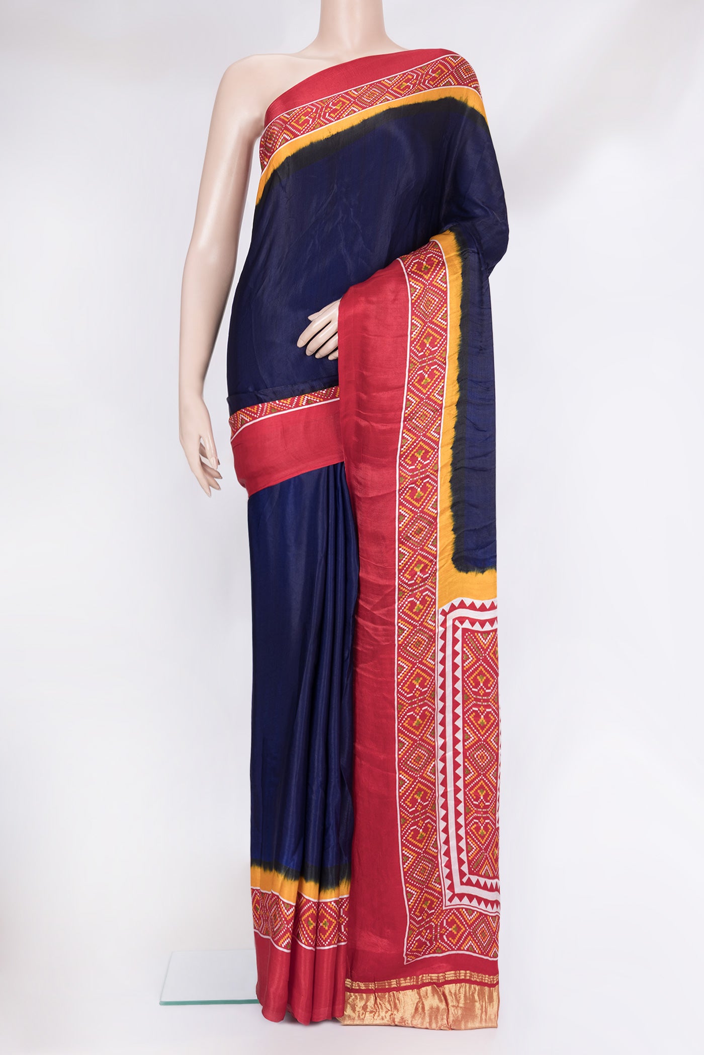 Blue Blended Satin Crepe Saree with Printed design on the body and Printed Border.  displayed on a mannequin