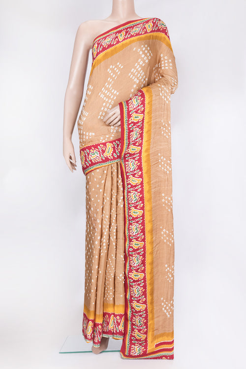 Beige Blended Satin Crepe Saree with Bandhani Print on the body and Printed Border.  displayed on a mannequin