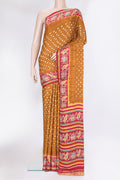Mustard Blended Satin Crepe Saree with Bandhani Print on the body and Printed Border.  displayed on a mannequin