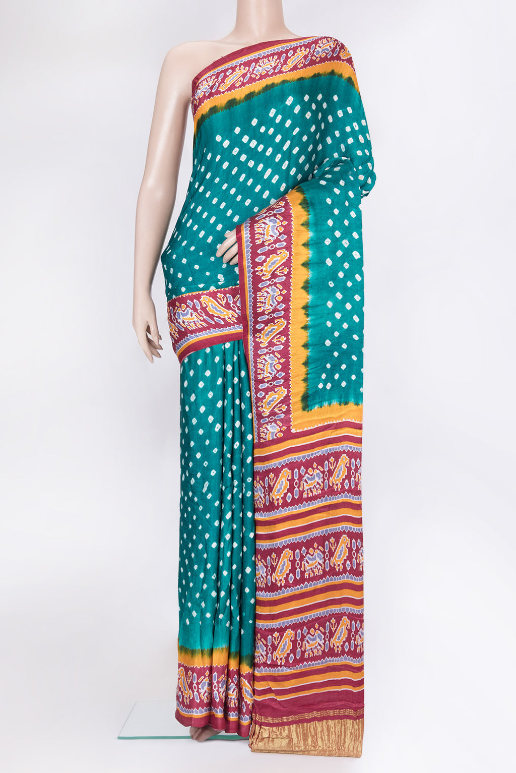 Blue Blended Satin Crepe Saree with Bandhani Print on the body and Printed Border.  displayed on a mannequin