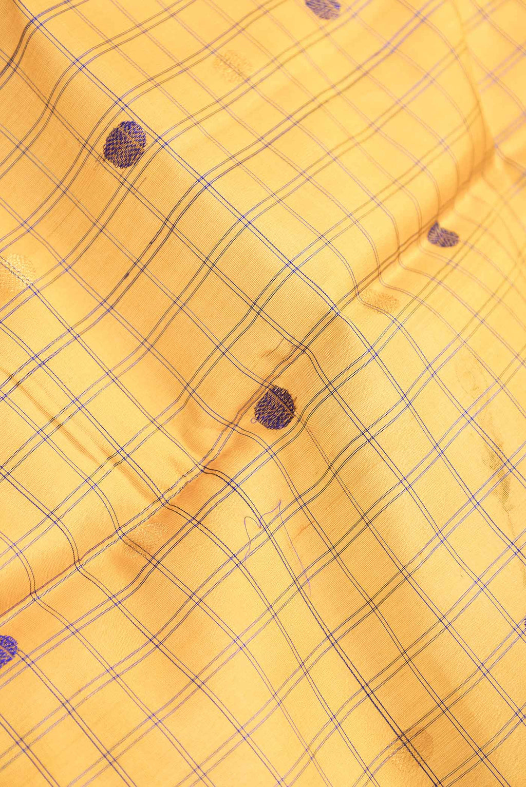 Close up of Mustard Dual Tone Gadwal Silk Saree with Zari And Thread Butta on the body and Zari Border.  displaying folds