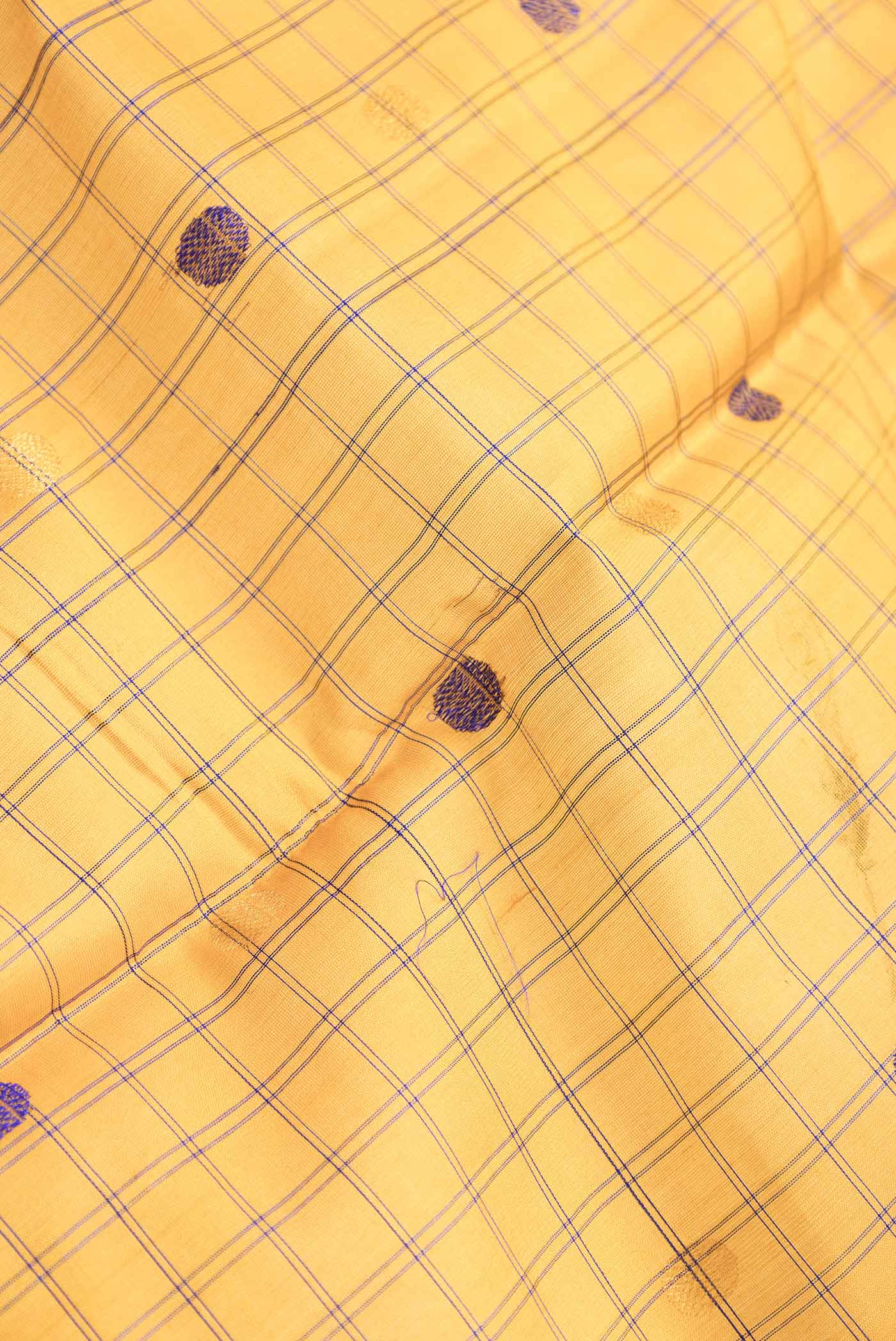 Close up of Mustard Dual Tone Gadwal Silk Saree with Zari And Thread Butta on the body and Zari Border.  displaying folds