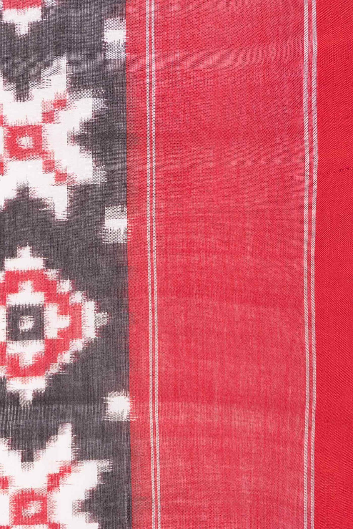Border image of Black Dual Tone Double Ikat Saree with Ikat Print on the body and Plain Border