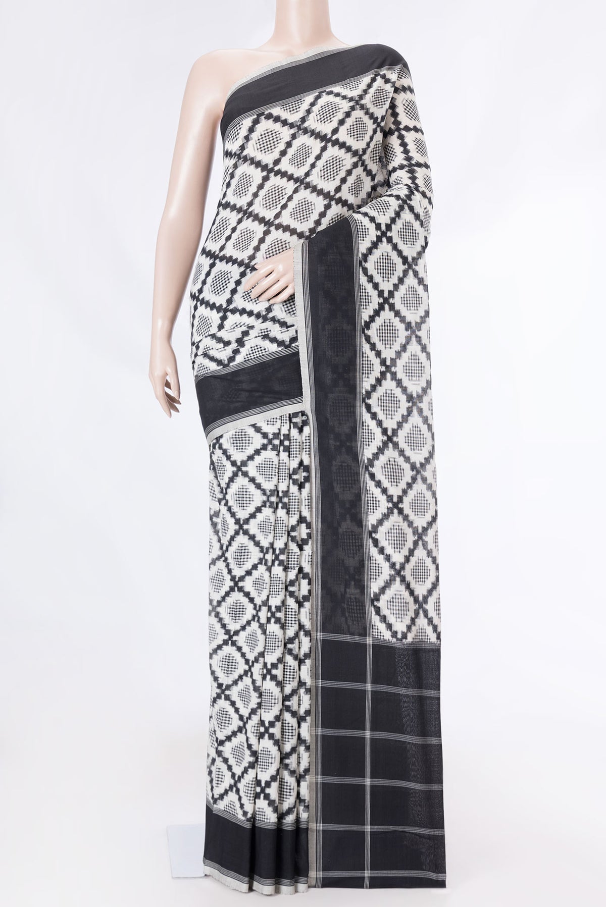 Off White Dual Tone Double Ikat Saree with Ikat Print on the body and Plain Border displayed on a mannequin