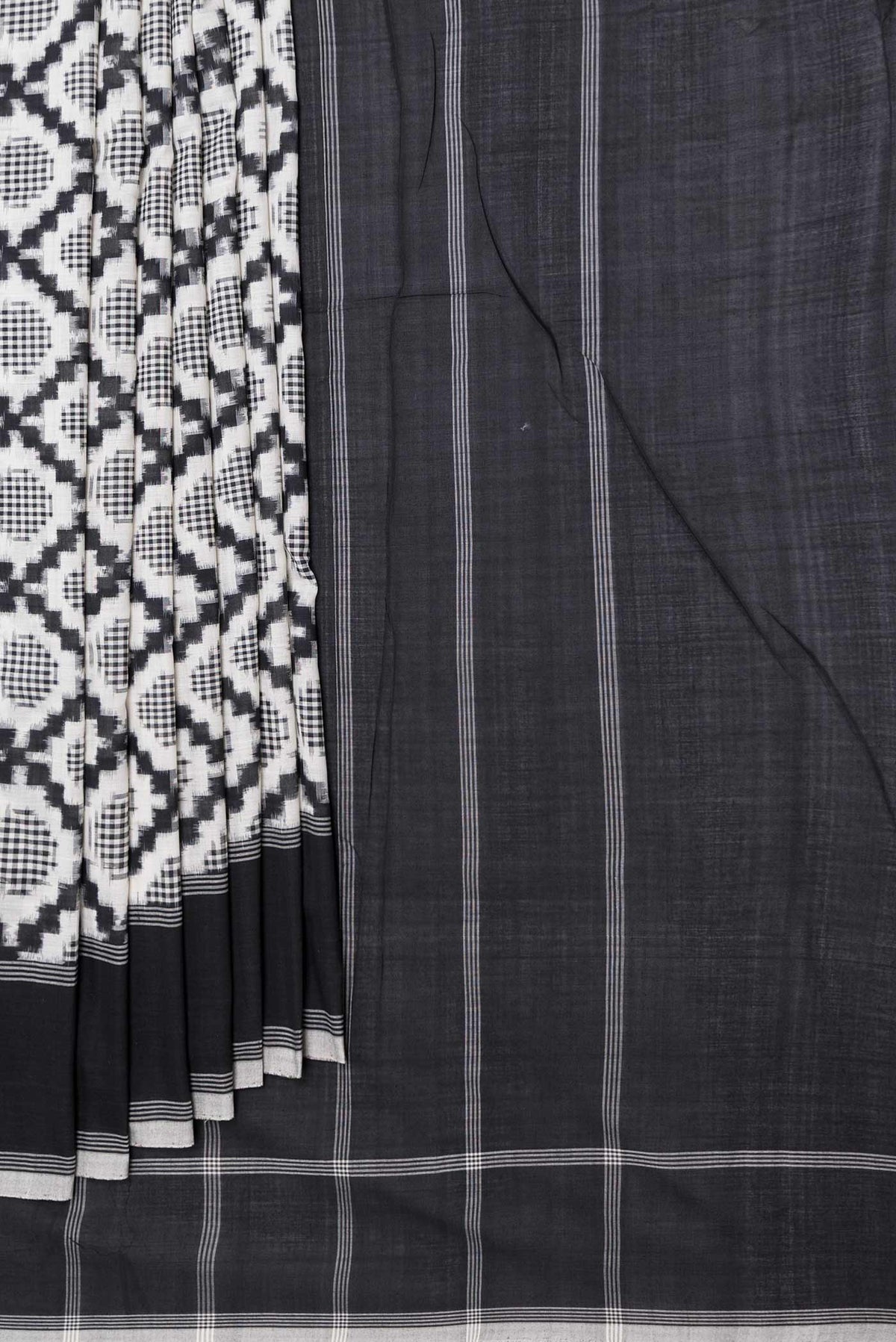 Pleats and pallu of Off White Dual Tone Double Ikat Saree with Ikat Print on the body and Plain Border