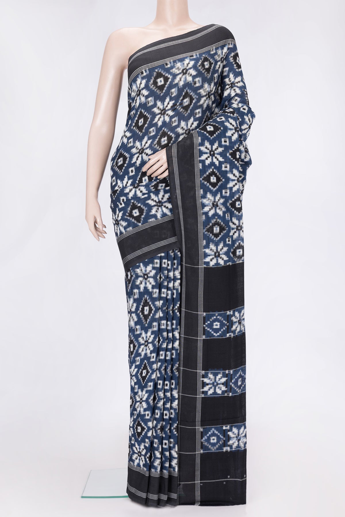 Blue Dual Tone Double Ikat Saree with Ikat Print on the body and Thread Border.  displayed on a mannequin