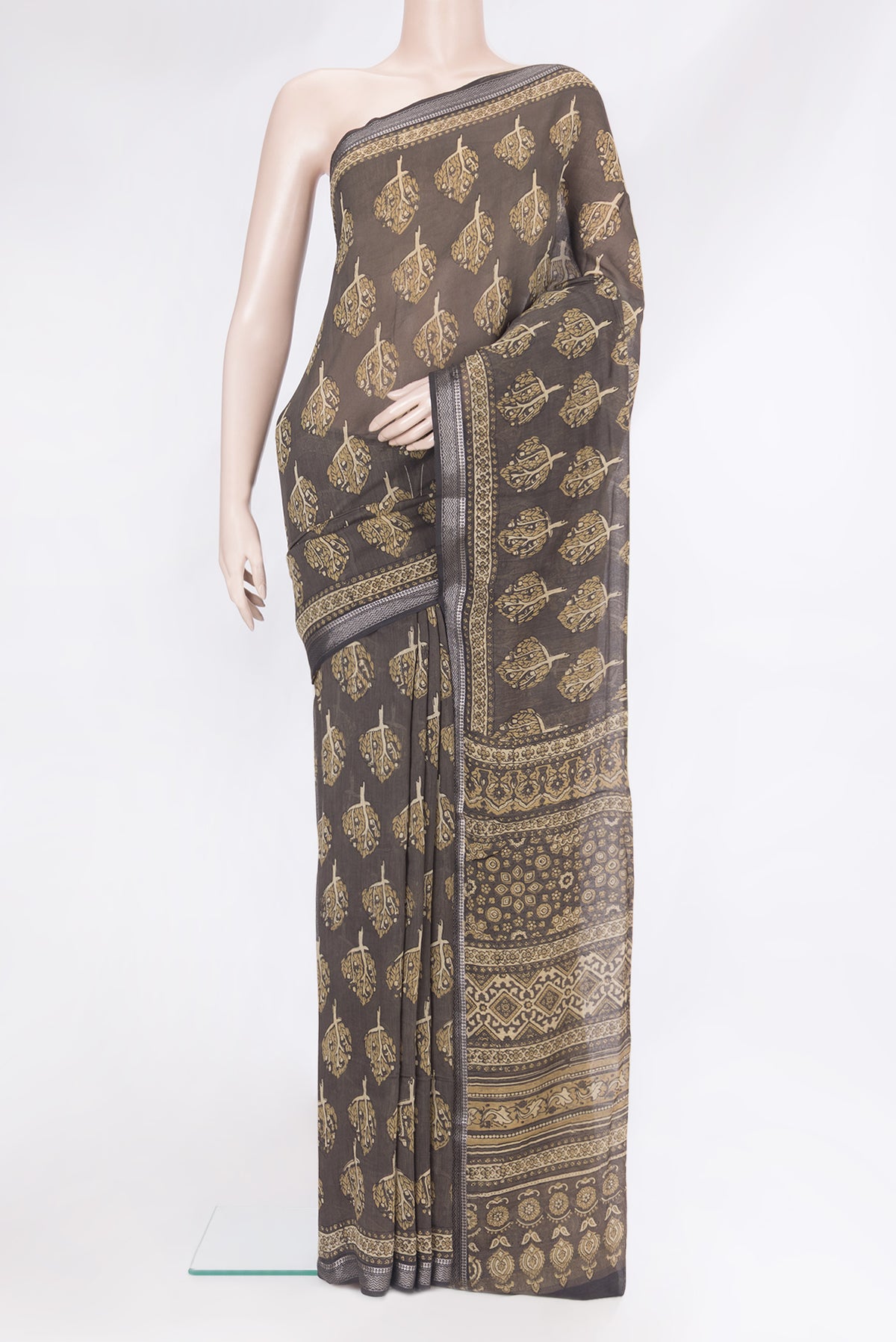 Brown Chanderi Silk Cotton Saree with Printed design on the body and Zari Border.  displayed on a mannequin
