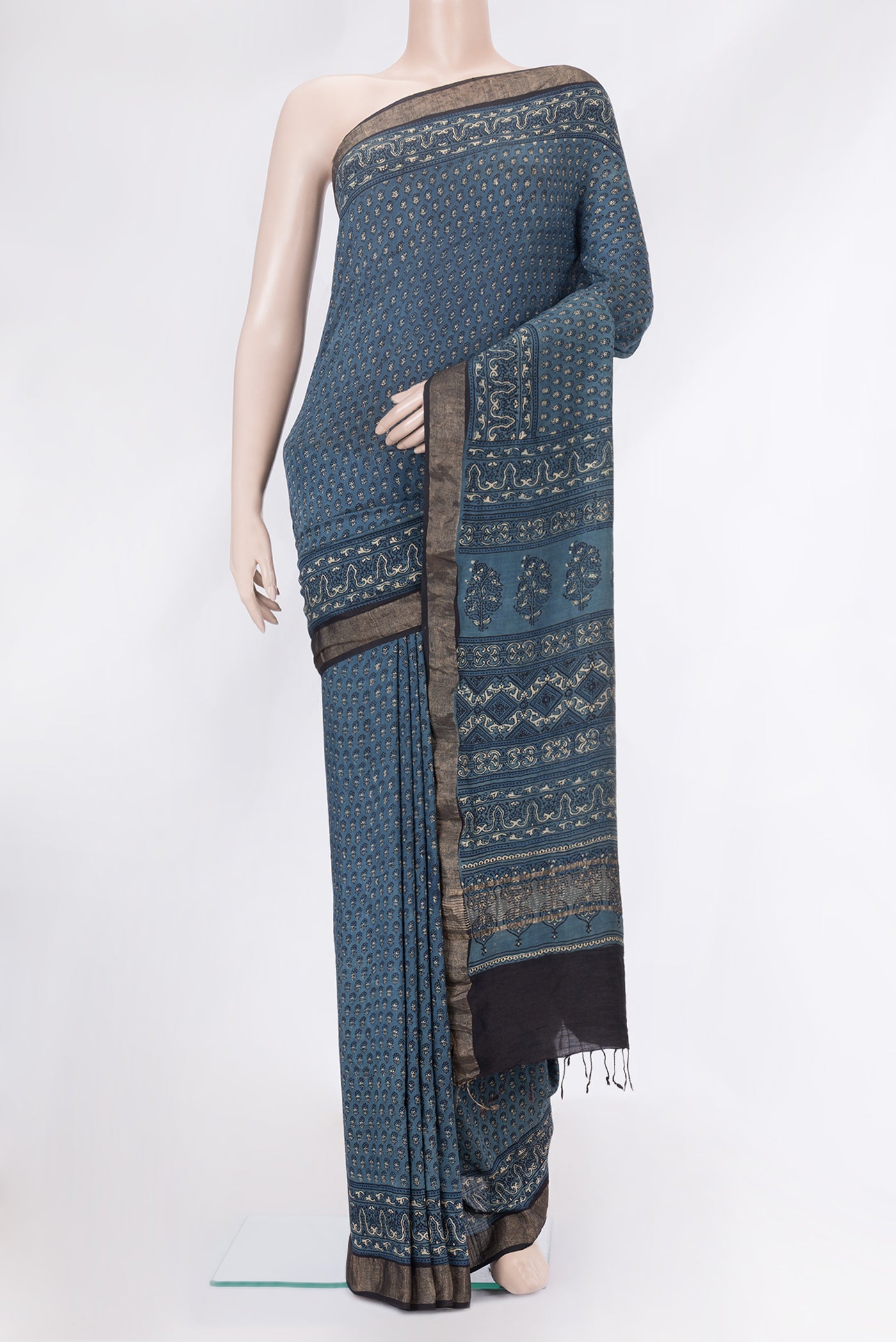 Blue Grey Dual Tone Tussar Silk Saree with Printed design on the body and Zari Border.  displayed on a mannequin