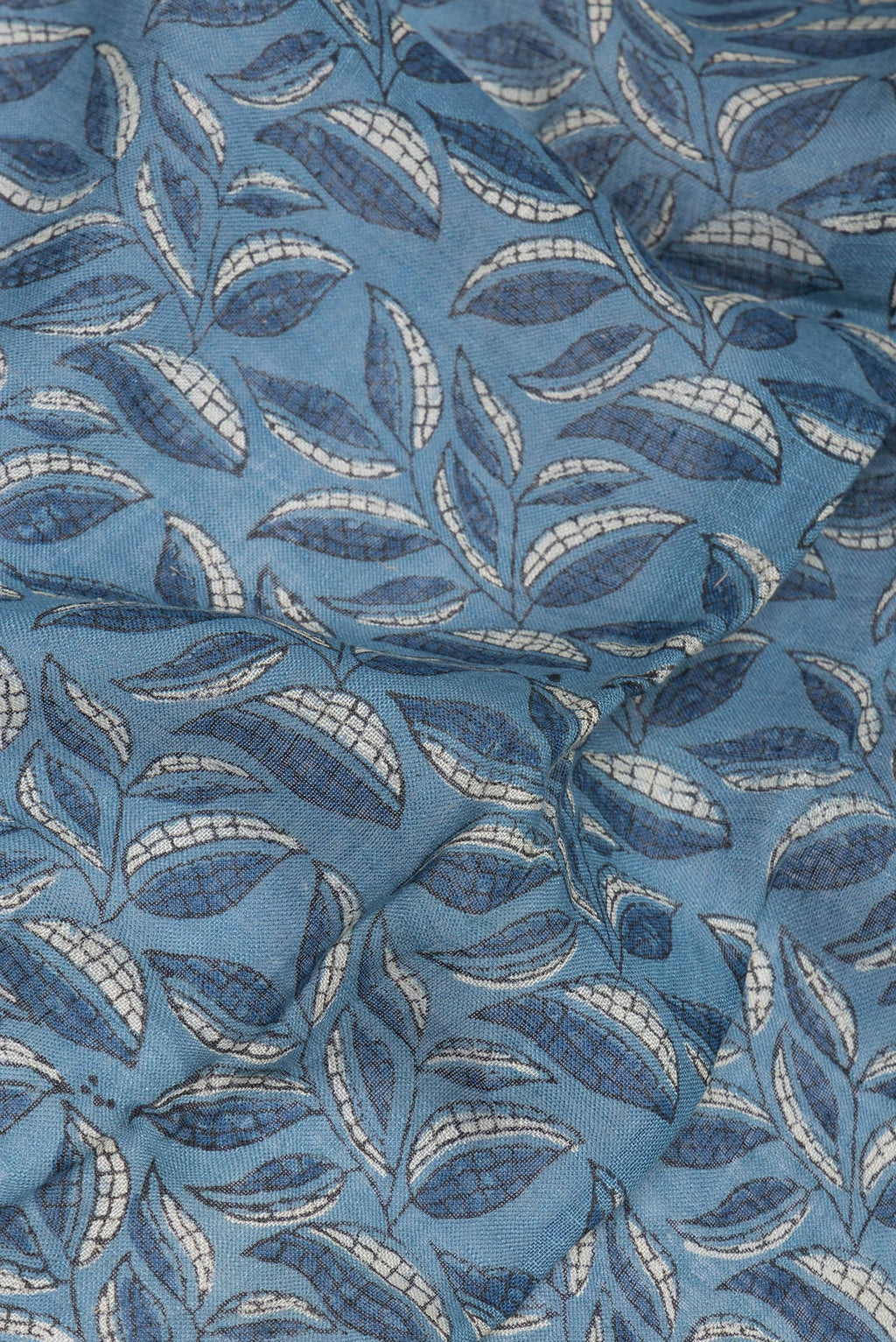 Close up of Blue Grey Linen Saree with Ajrakh Print on the body and Zari Border.  displaying folds