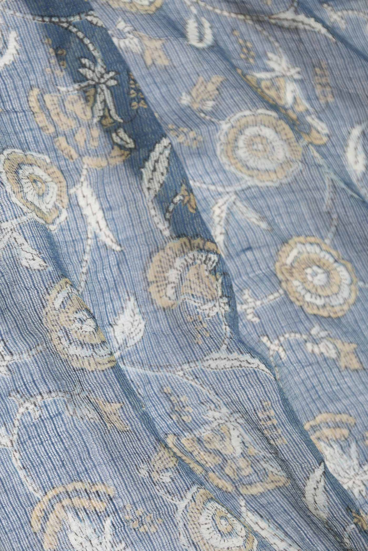 Close up of Blue Dual Tone Kota Silk Saree with Printed design on the body and Zari Border displaying folds